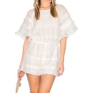 White romper with ruffled bell sleeves